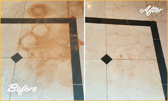 Before and After Picture of a White Sands Hard Surface Restoration Service on a Marble Floor to Eliminate Rust Stains